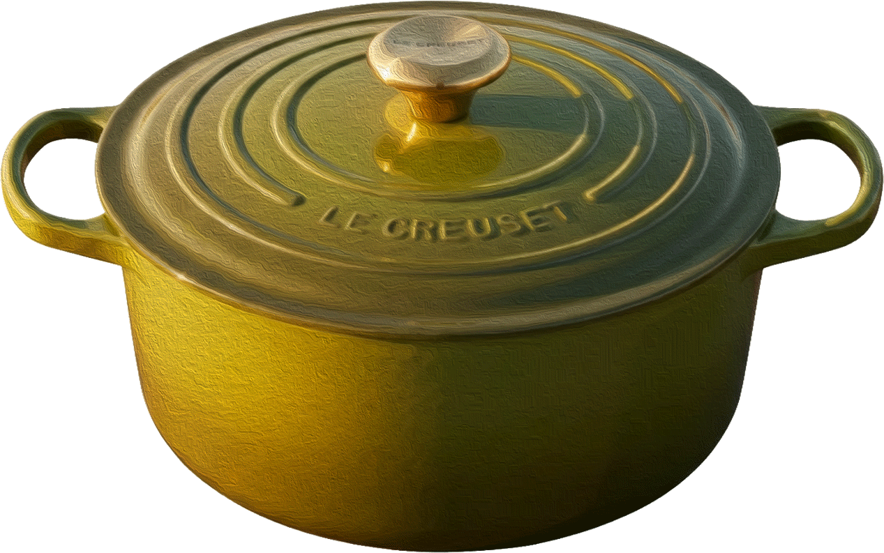 A green Le Creuset enameled cast iron round dutch oven